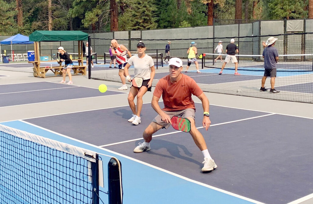 two players on pickleball court