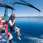 boy and lady parasailing