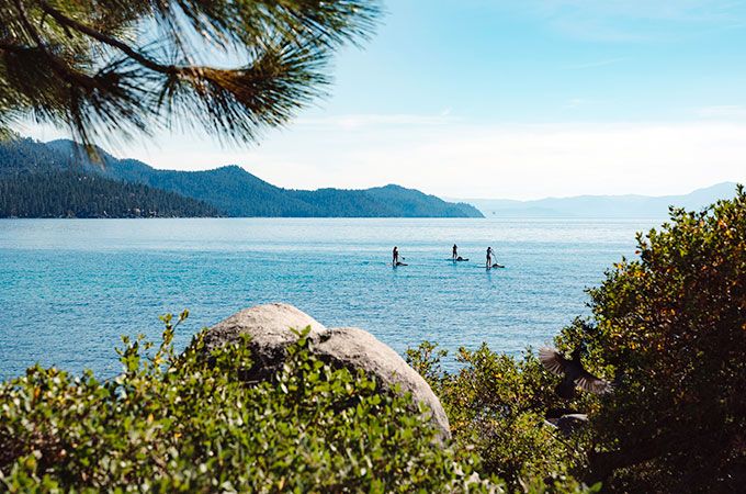 3 people on sup on lake tahoe